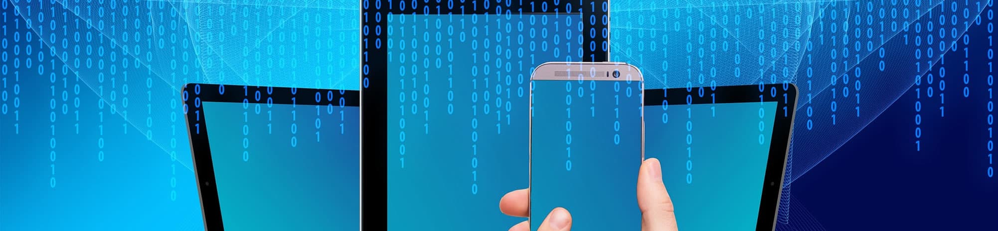 A phone and screens showing digital data, representing up-to-date business records
